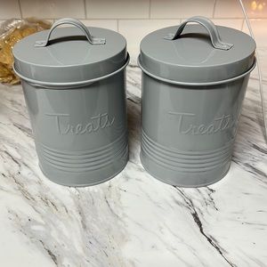 Two grey dog treat containers